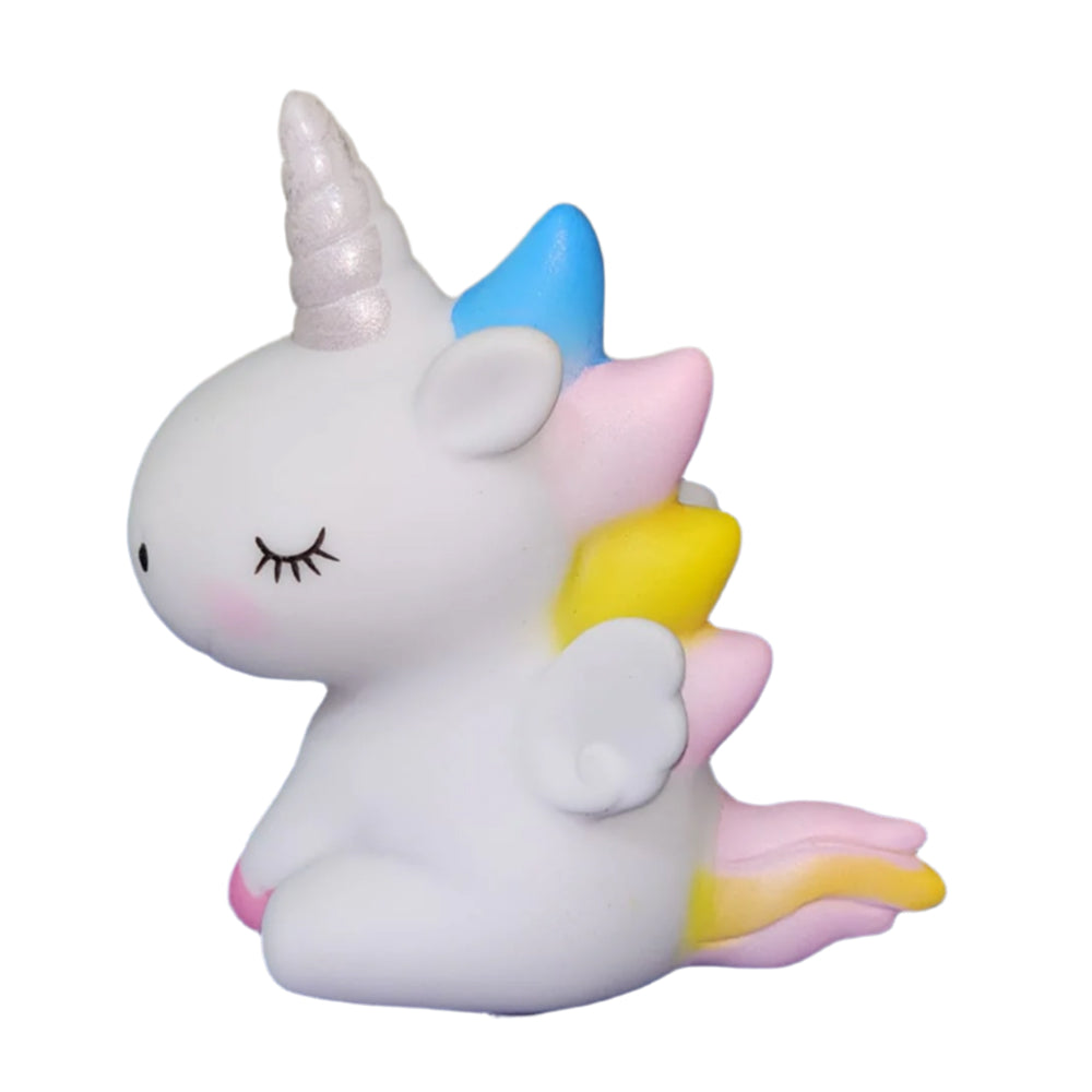 Close-up of Small White Cute Unicorn Cake Toy Topper on white background