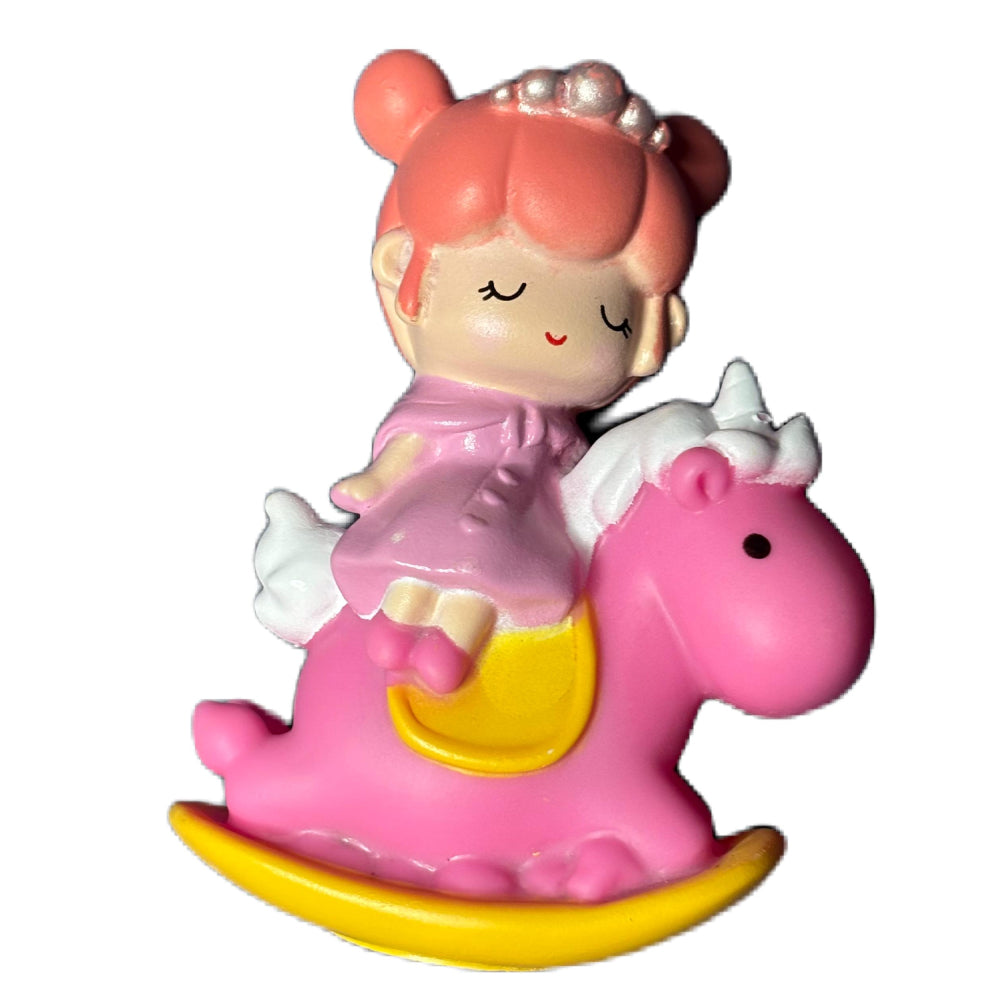 Close-up angled view of Small White Doll on Pink Horse Cake Topper on white background