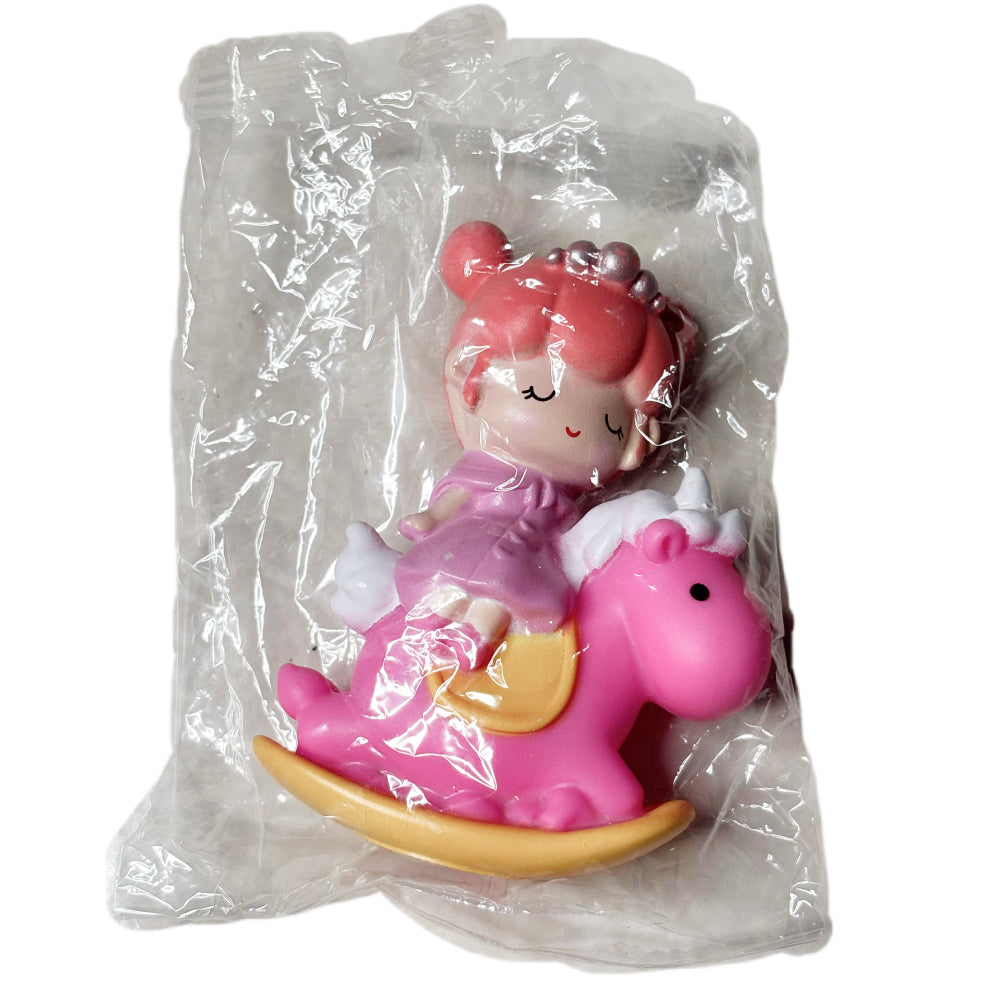 Small White Doll on Pink Horse Cake Topper in packaging on white background
