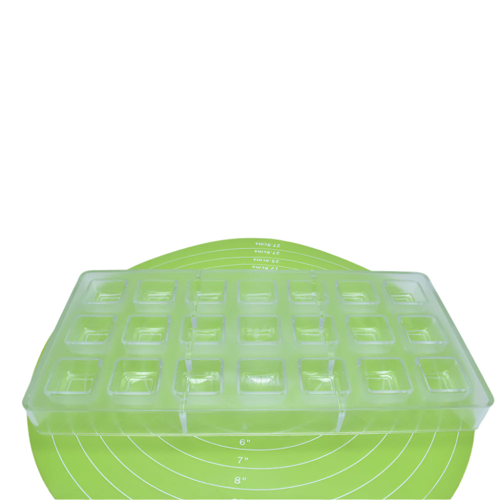 Square Shaped Polycarbonate Chocolate Bar Mold placed on a green baking mat against a white background for a detailed view.