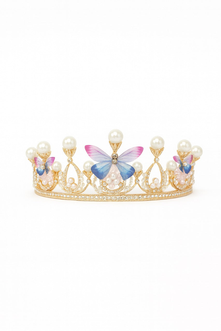 Gold tiara topper with butterfly decorations on a white background