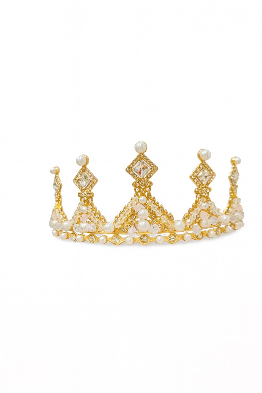 Gold tiara with pearls topper on a white background