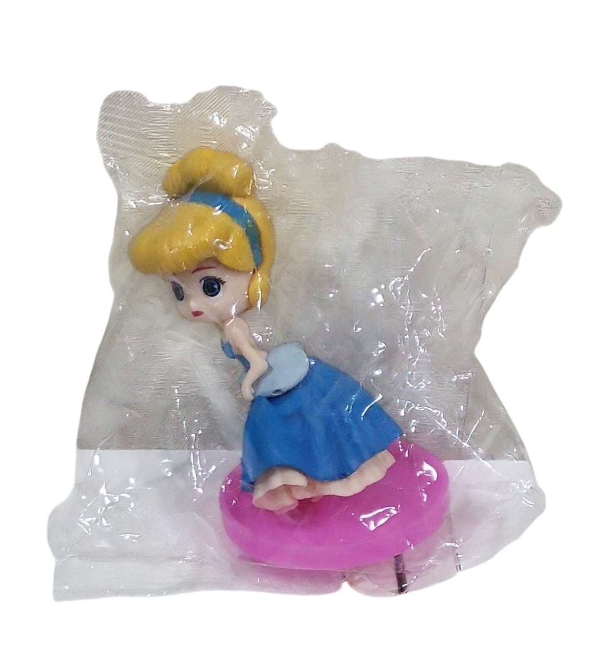 Toy figure of a princess in a blue dress with a yellow bow, sitting on a pink object in a clear transparent bag on a transparent background