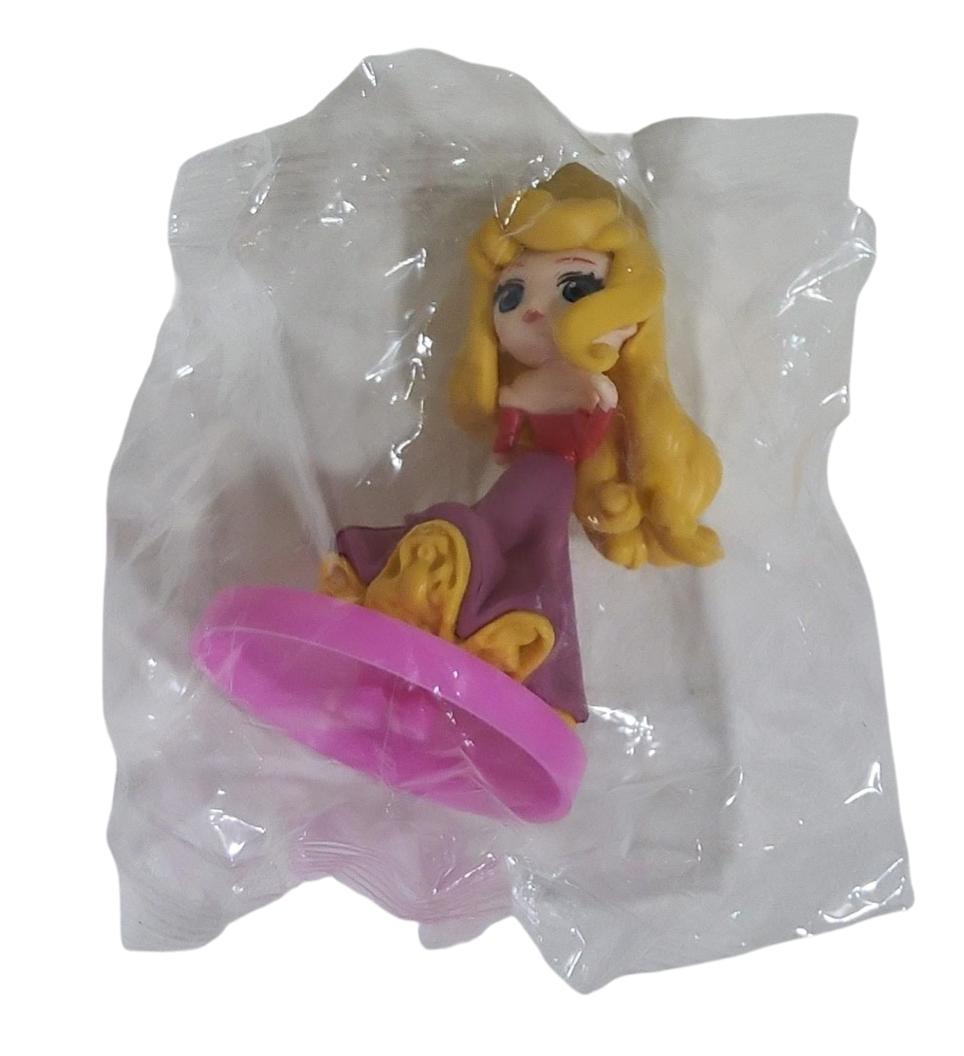 Toy figure of a princess in a clear transparent bag on a transparent background