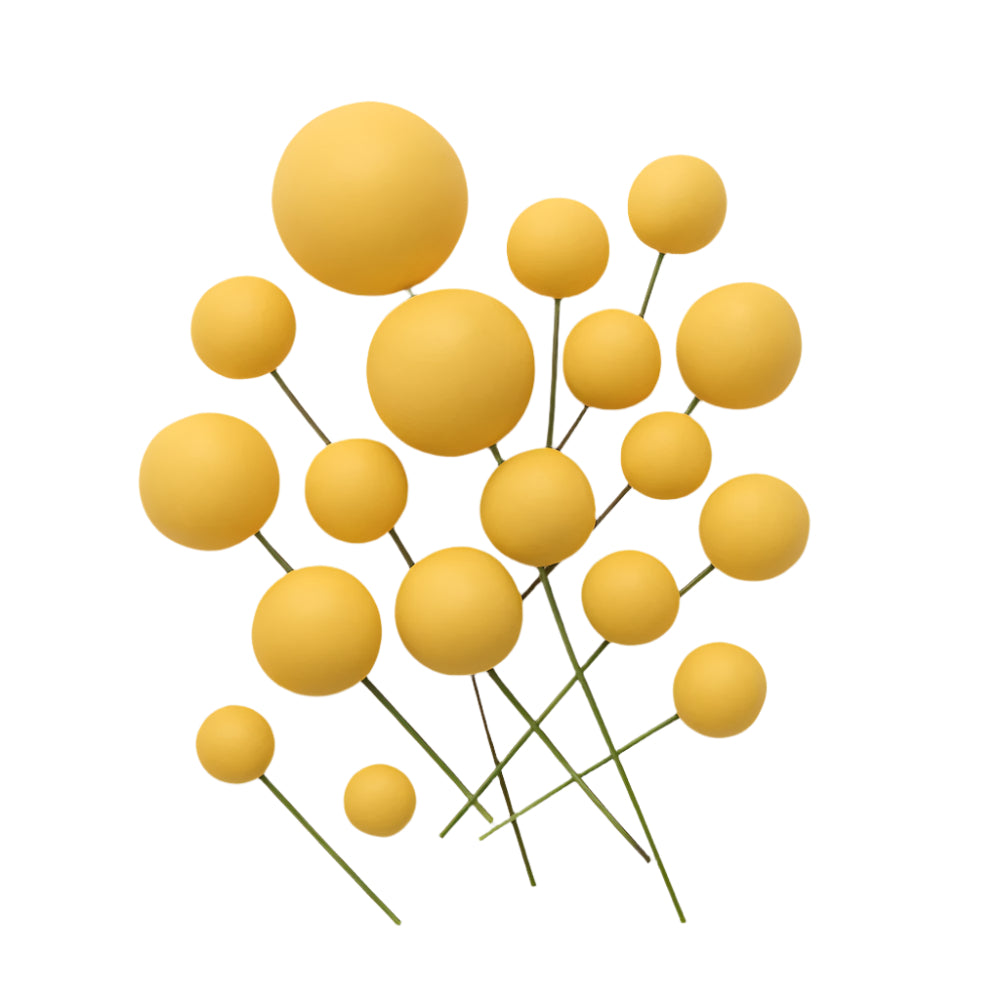 A set of decorative Yellow Matte faux balls spread evenly on a white background, showcasing their color and texture for cake decoration.