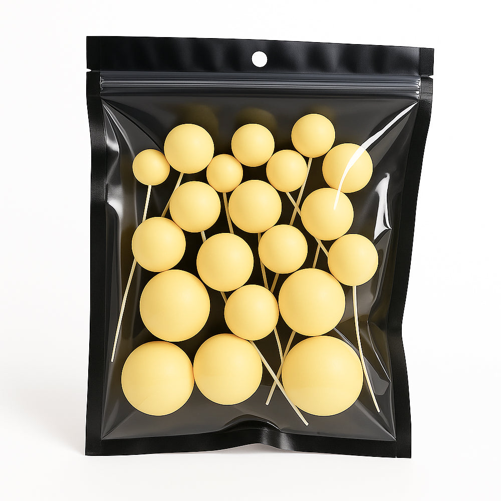 Yellow matte faux balls in assorted sizes sealed inside a transparent zip-lock packet – ideal for modern cake decoration or DIY crafts