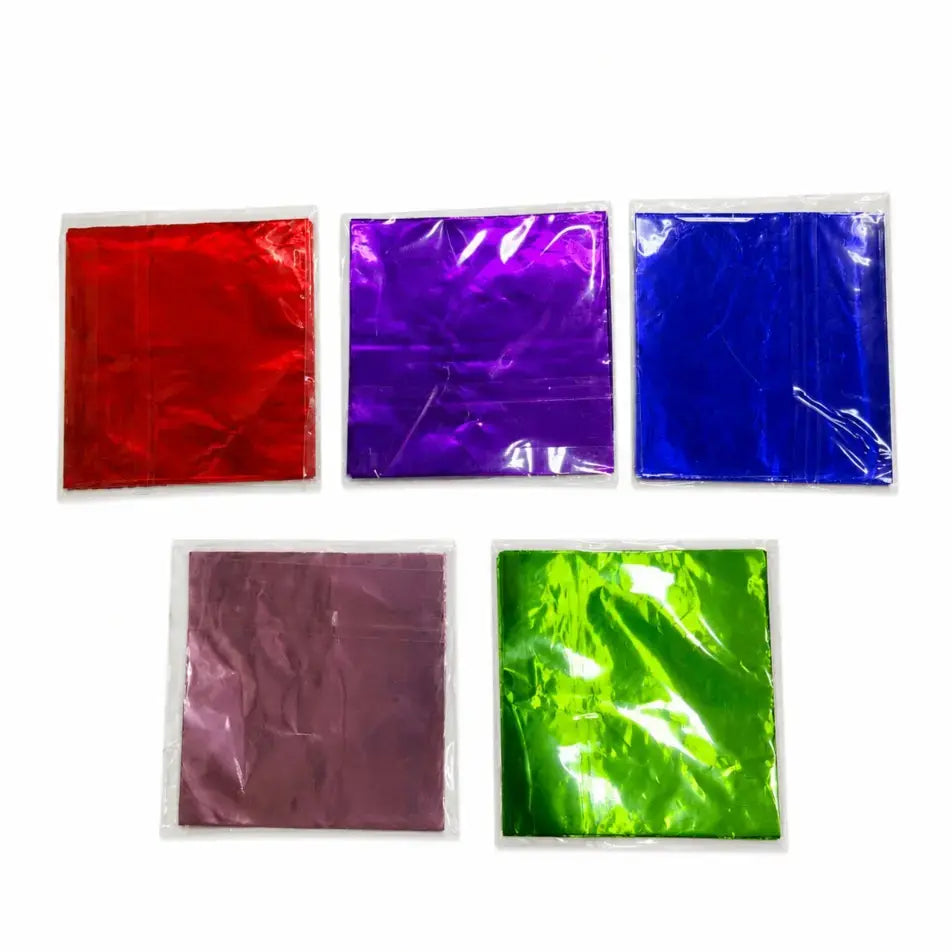 Five square metallic sheets in red, purple, blue, pink, and green on a white background.