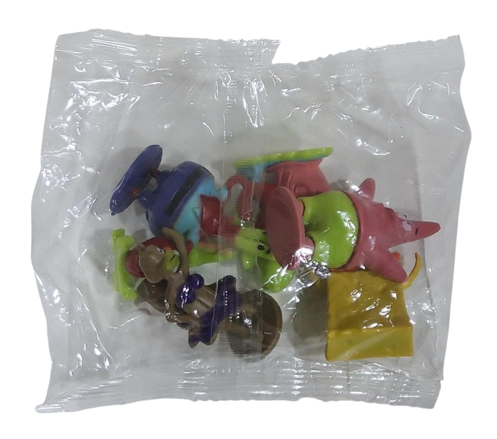 Colorful PVC Spongebob toys in a transparent plastic bag on a transparent background