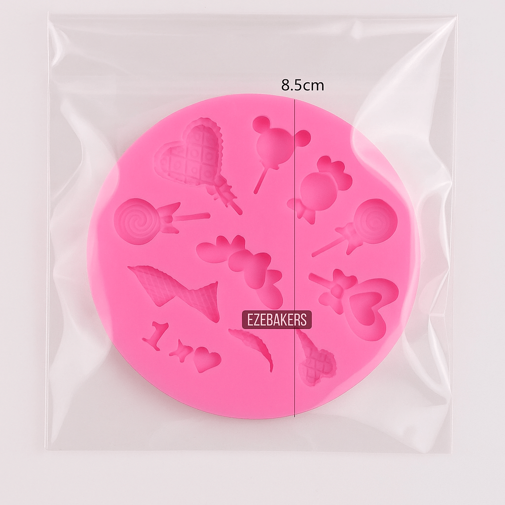 Pink silicone mold with various shapes on a clear background