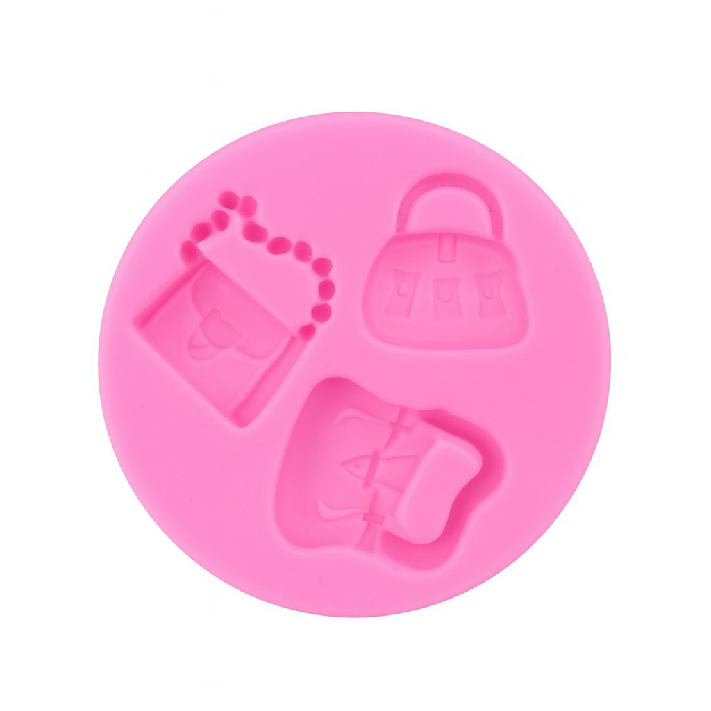 Pink silicone mold with various bag shapes on a white background