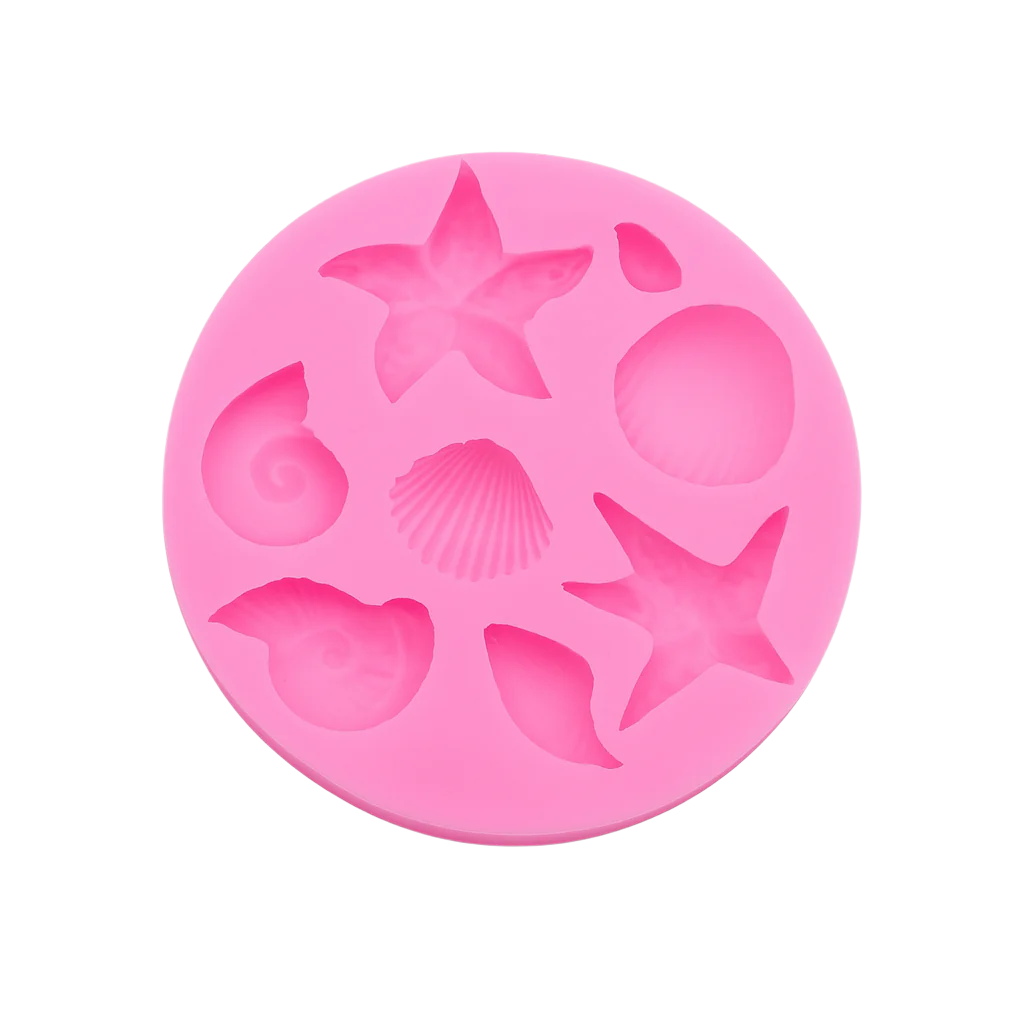 Pink silicone mold with starfish and shell shapes on a white background