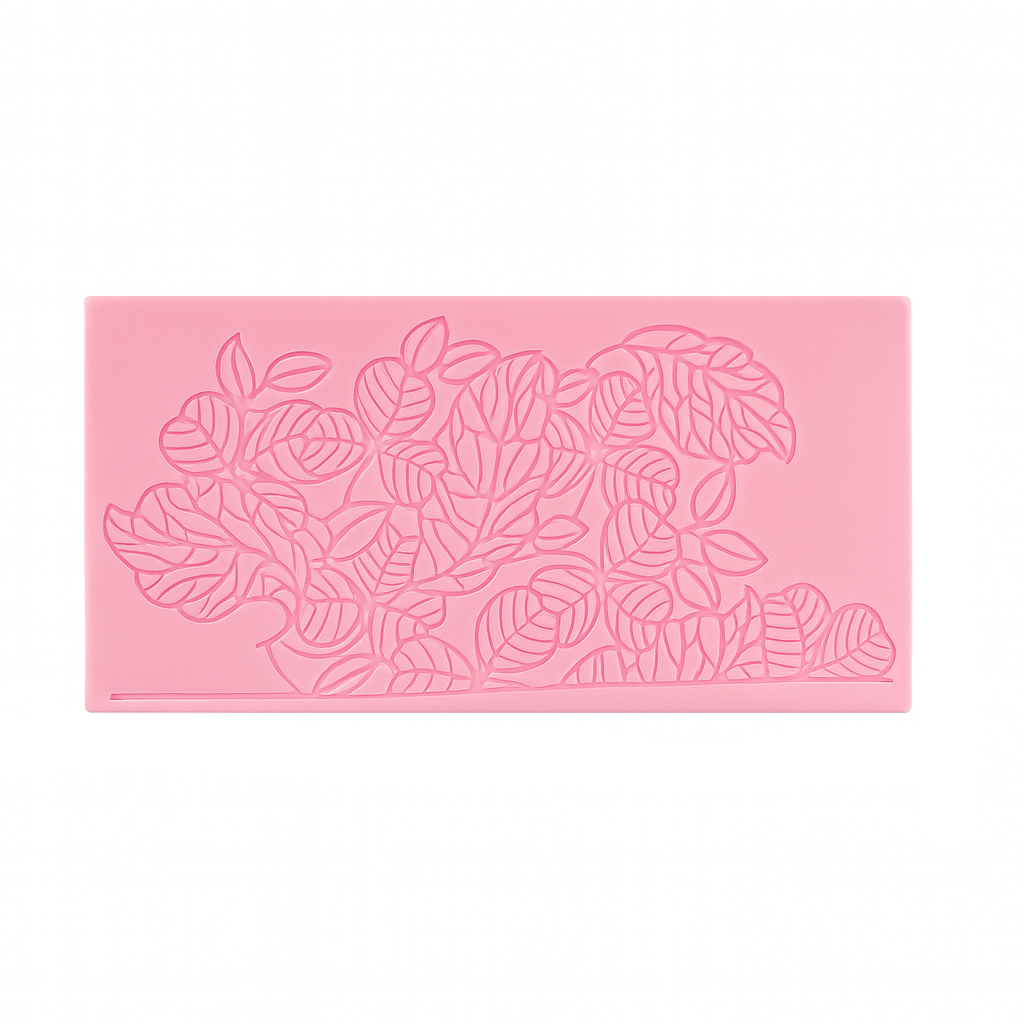 Pink silicone fondant lace matwith leaf pattern on a white background