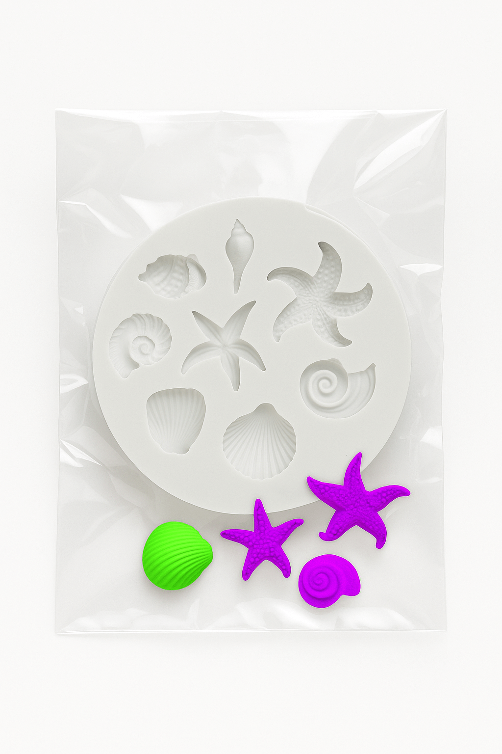 Decorative fondant mold with starfish and shell designs in a clear package on a white background