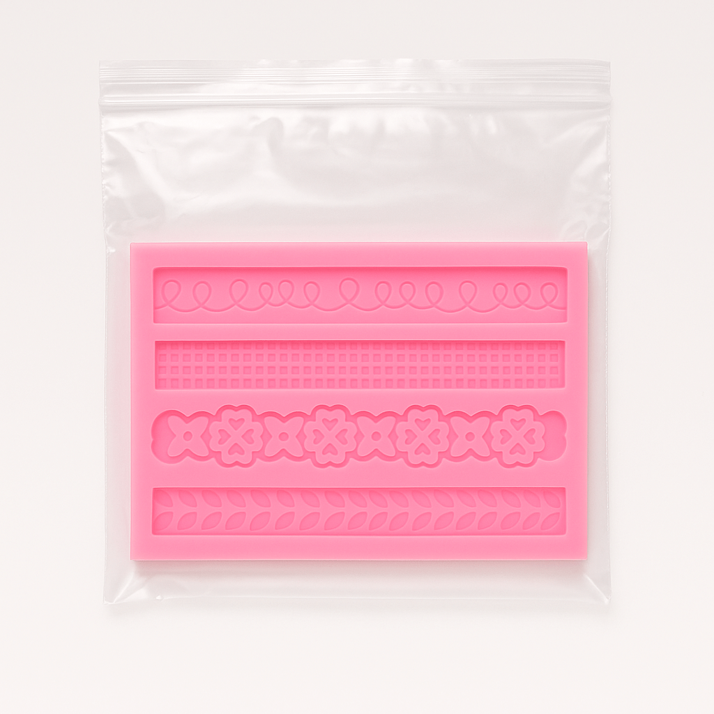 Pink silicone mold with decorative patterns in clear packaging on a white background