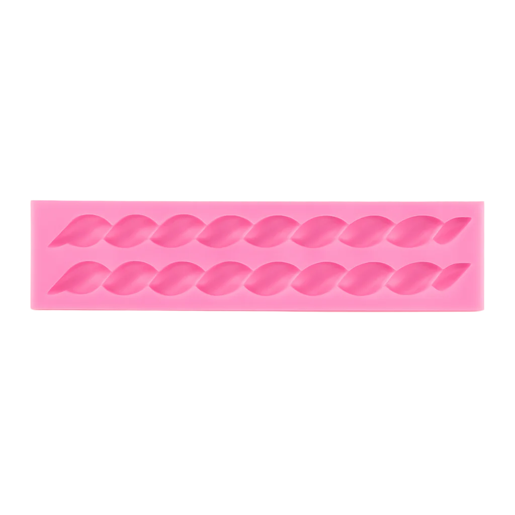 Pink silicone fondant mold with on a white background