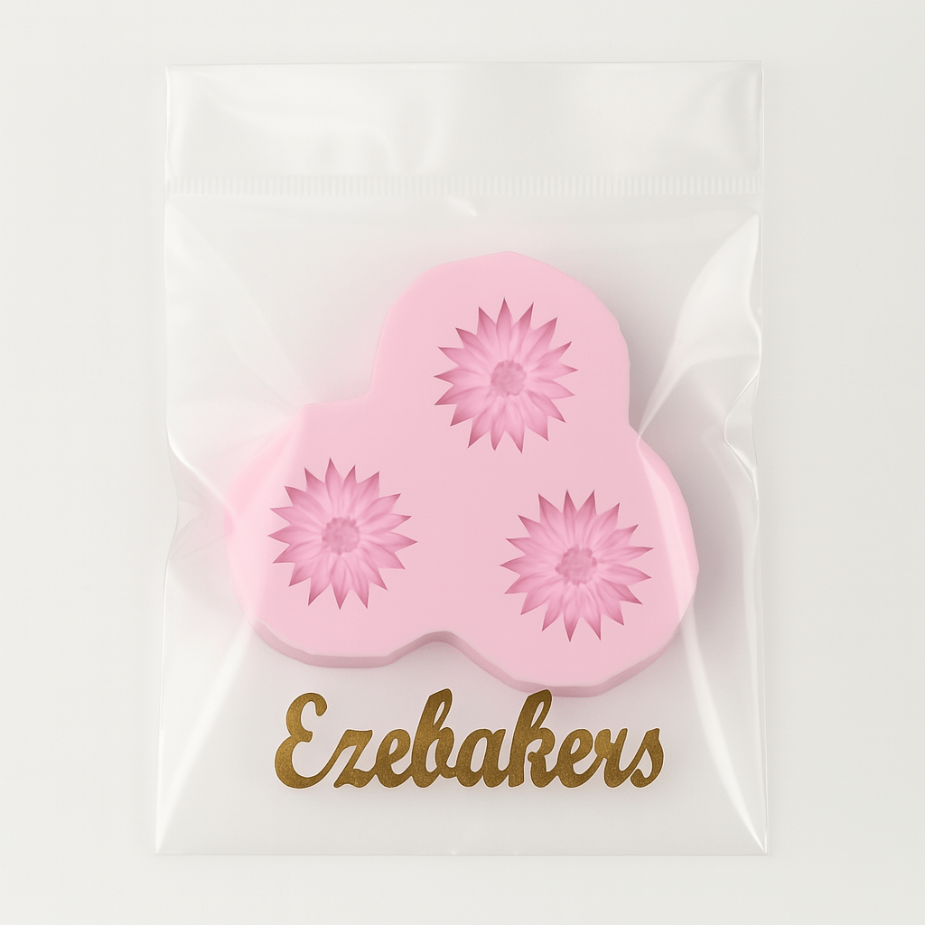 Pink flower-shaped silicone fondant mold with floral designs on a clear background, branded 'Ezebakers'.