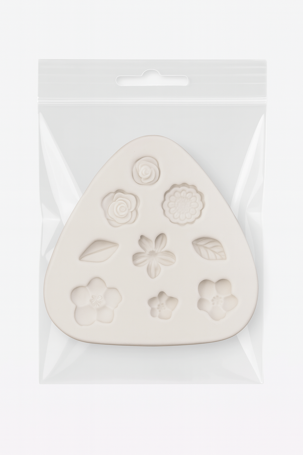 Flower-shaped silicone mold in a clear plastic packaging on a white background