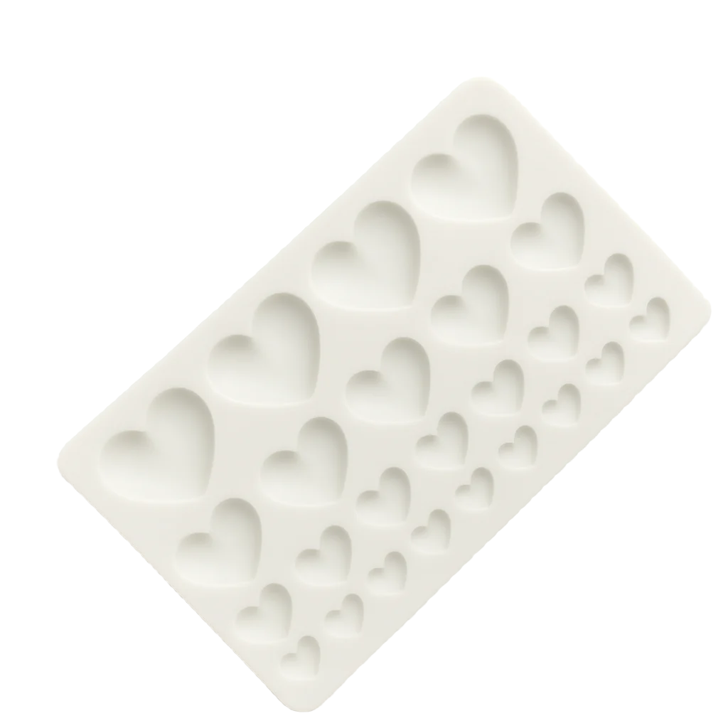 Silicone fondant mold with heart shapes on a white background