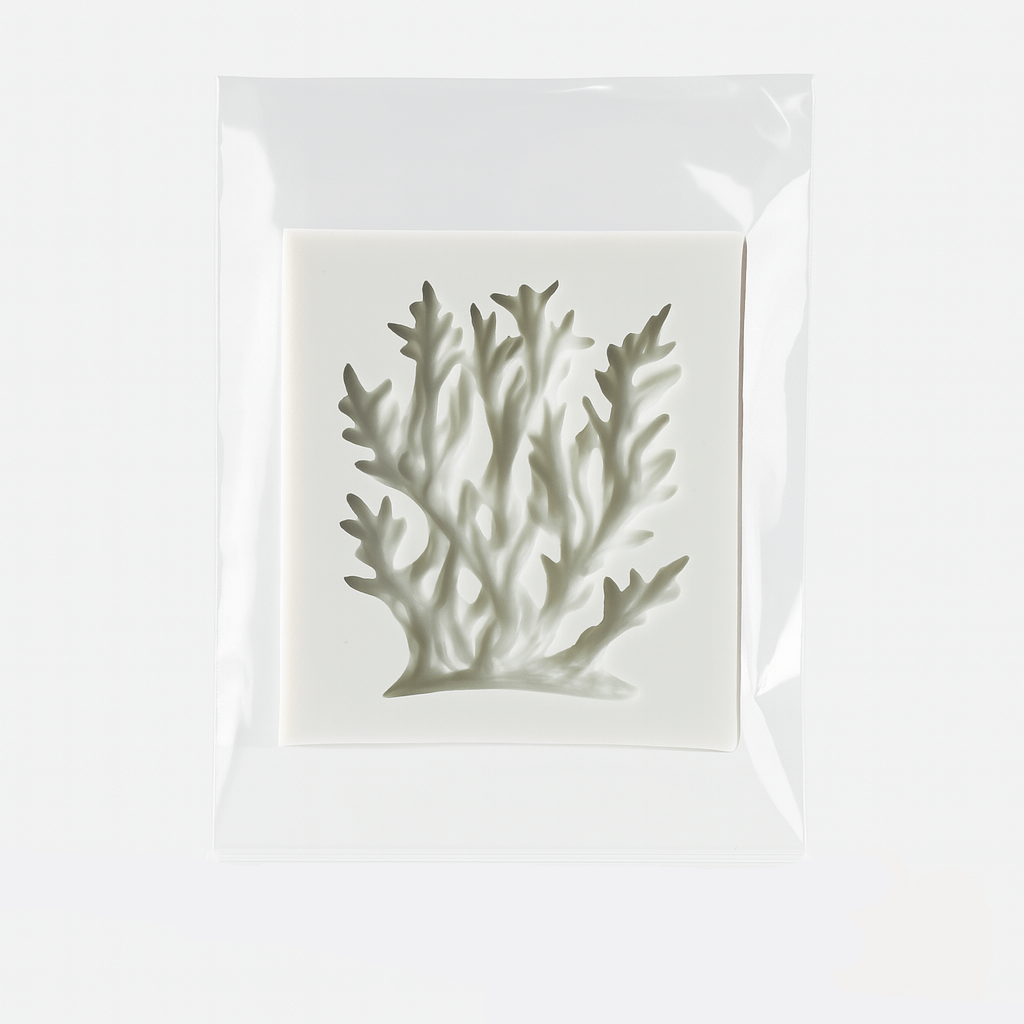 Coral themed silicone fondant mold in it's packaging on a white background.