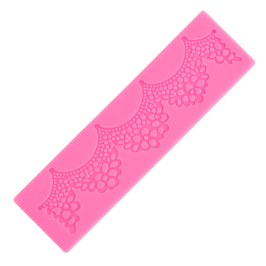 Pink silicone fondant lace mat with design on a white background