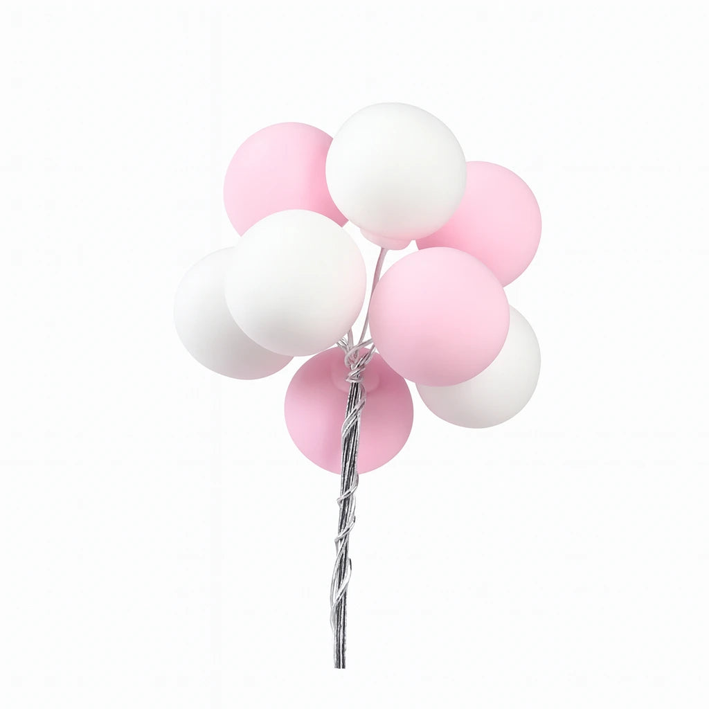 Bouquet of pink and white balloon cake toppers on a white background
